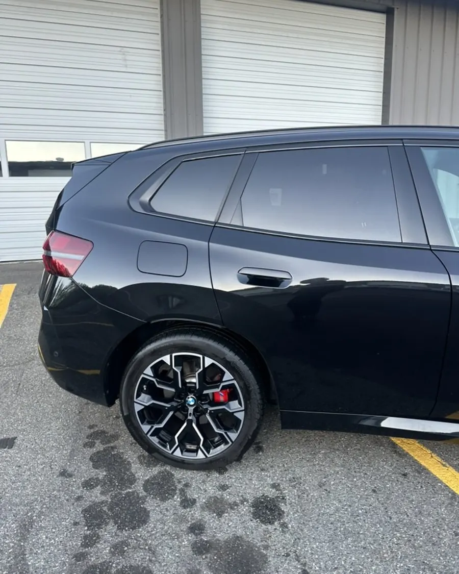 Black SUV side after exterior wash